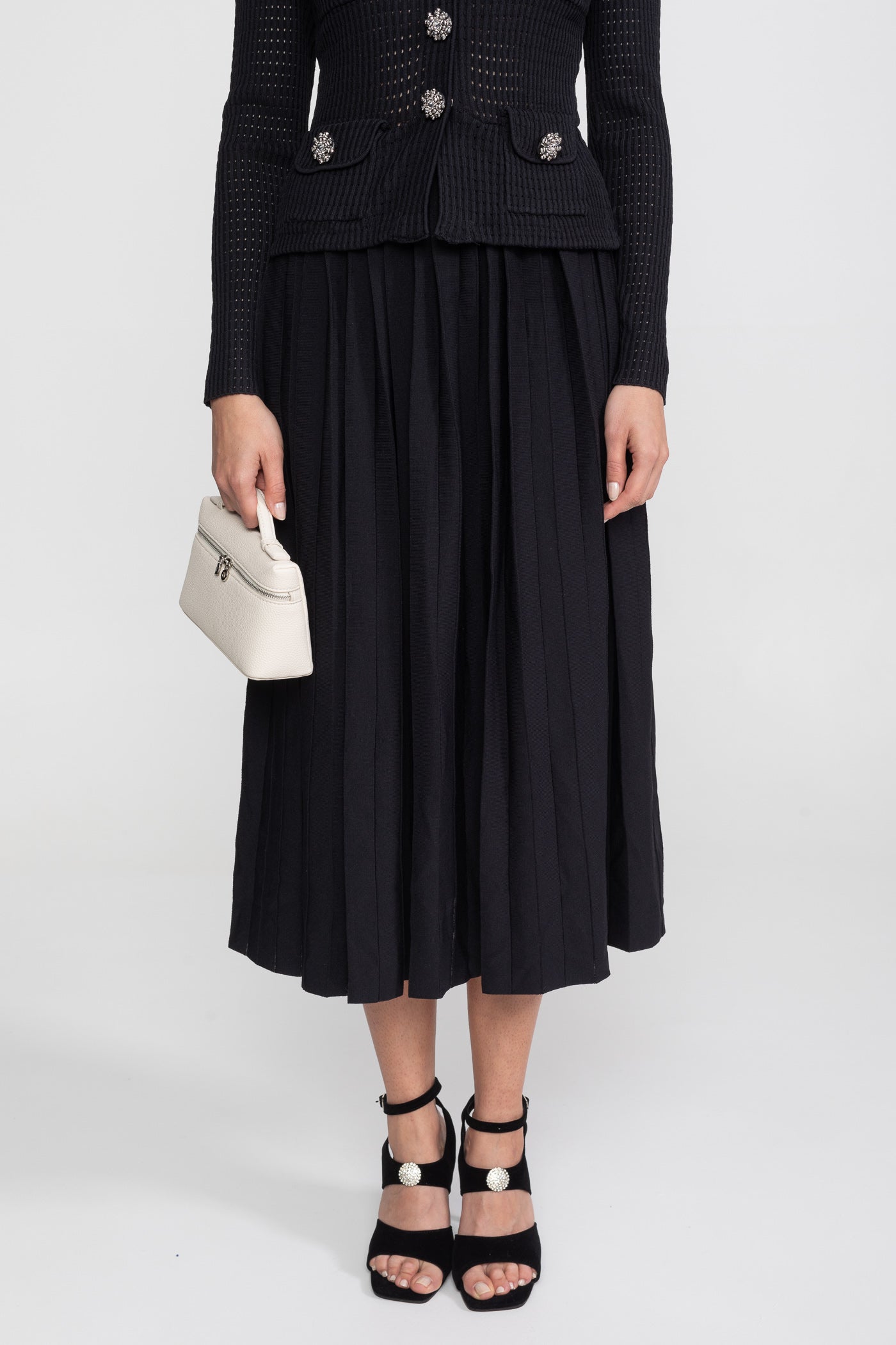 Co-Ord-Set aus offen gestricktem Cardigan und plissiertem Midi-Rock - Schwarz