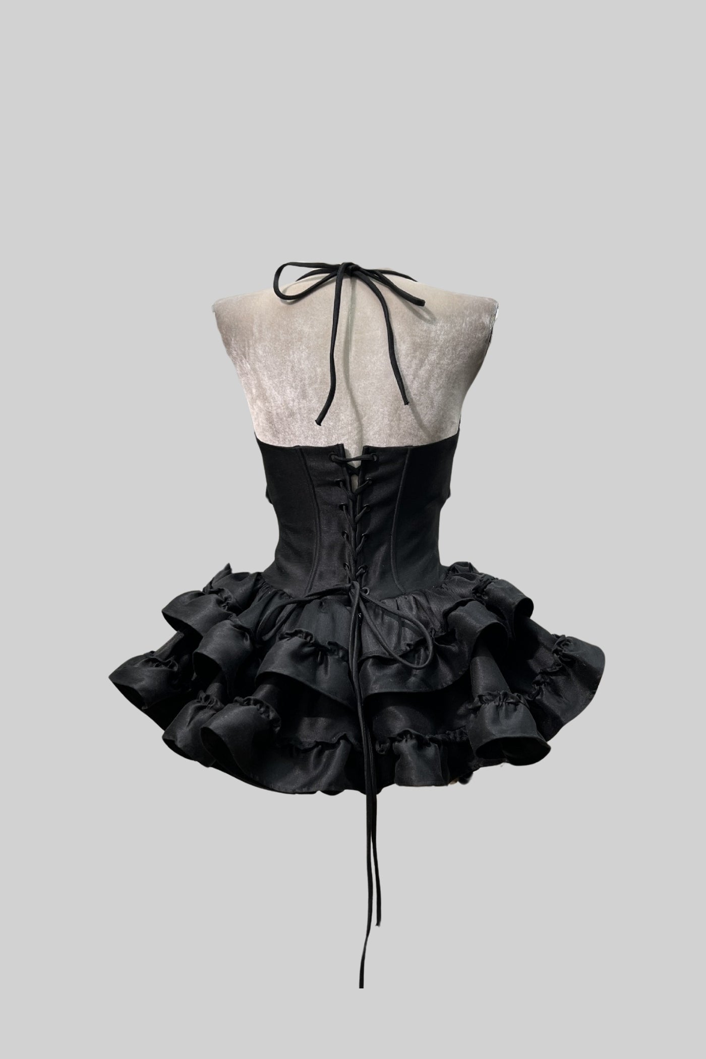 Ärmelloses Kleid mit Korsett-Oberteil und ausgestelltem Minirock - Schwarz 