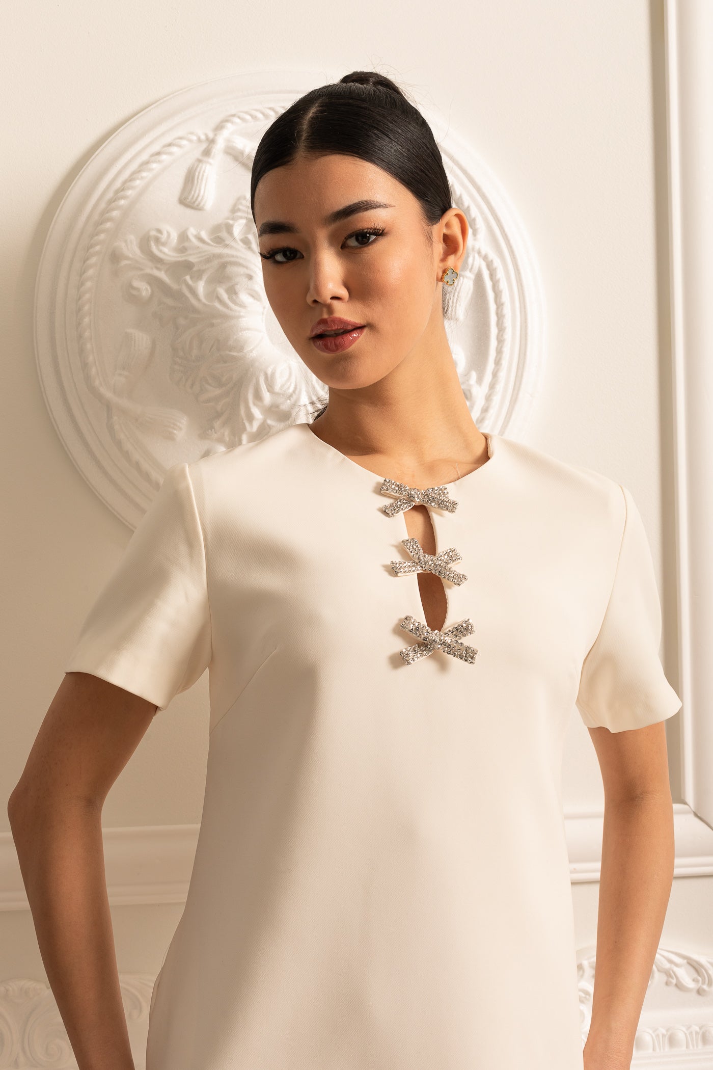 White Short Sleeved Mini Dress With Sparkling Neckline Bows