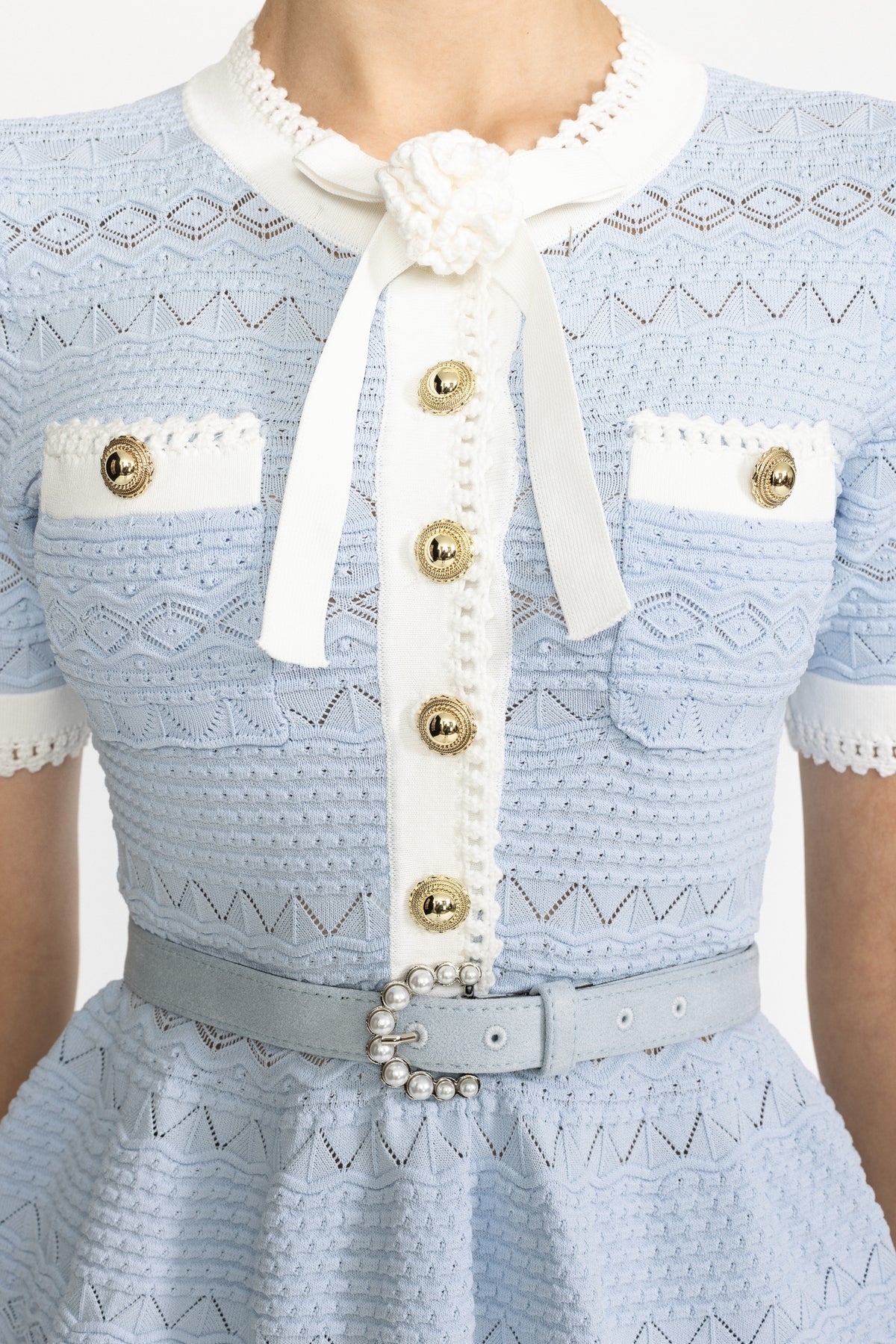 Pointelle-Stricktop mit Schleife und Schößchen - Hellblau 